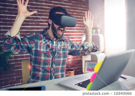 Surprised creative businessman wearing 3D video glasses Surprised creative businessman wearing 3D video glasses 18840066