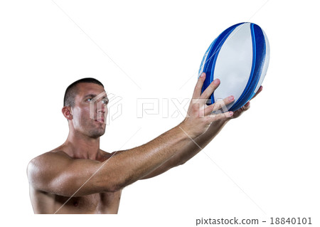 Shirtless rugby player holding ball 18840101