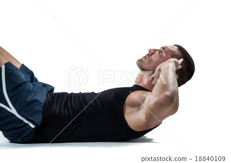 Determined athlete doing crunches Determined athlete doing crunches 18840109