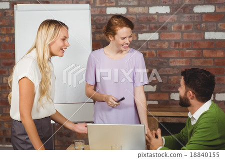Business colleagues smiling during discussion 18840155