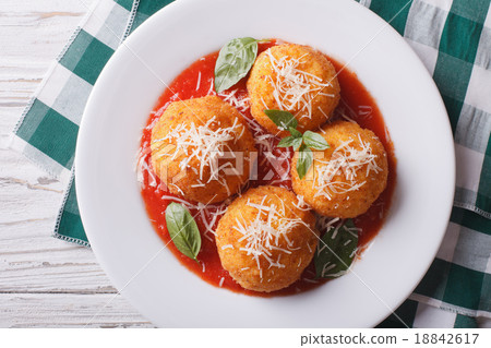 fried arancini rice ball with tomato sauce closeup 18842617
