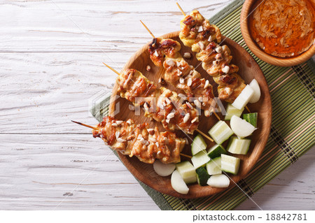 Chicken satay with delicious peanut sauce top view 18842781