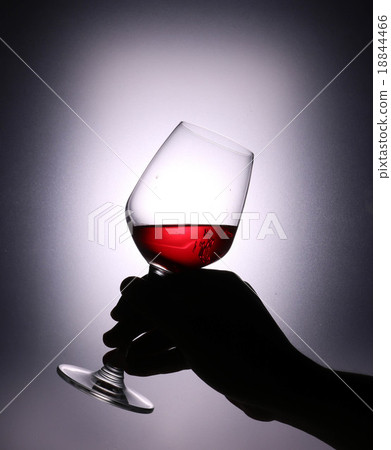 Hand holding a wine glass. Silhouette concept Hand holding a wine glass. Silhouette concept 18844466