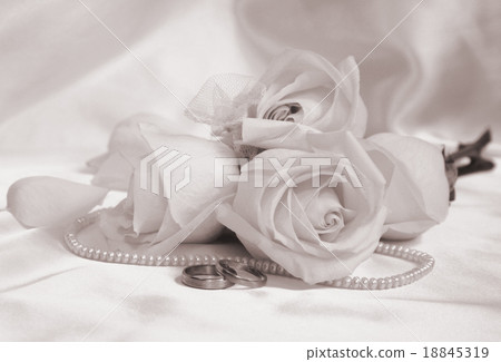 Wedding rings and roses as wedding background. Wedding rings and roses as wedding background. 18845319