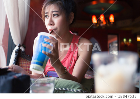 woman drink a hot coffee in cafe 18847535
