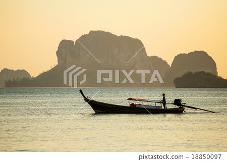 Longtail boat in the sea at the sunset 18850097