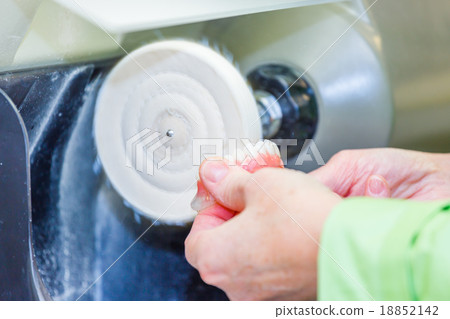 Dental technician working in dental laboratory 18852142
