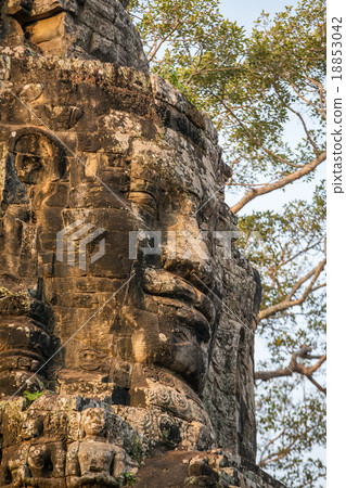 Stone face on the towers of ancient Bayon Temple Stone face on the towers of ancient Bayon Temple 18853042