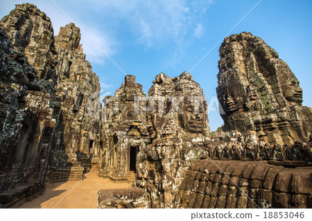 Stone faces on the towers of ancient Bayon Temple 18853046
