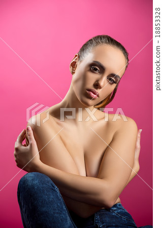 Studio image of beautiful brunette hugging herself Studio image of beautiful brunette hugging herself 18853328