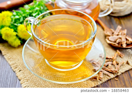 Tea of Rhodiola rosea in glass cup on sacking 18858463