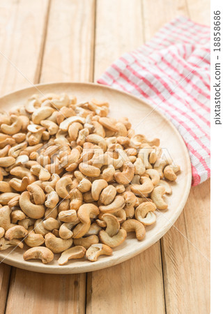 Salty cashew nuts in wooden plate 18858686