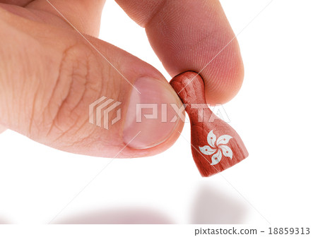 Hand holding wooden pawn, flag painting Hand holding wooden pawn, flag painting 18859313