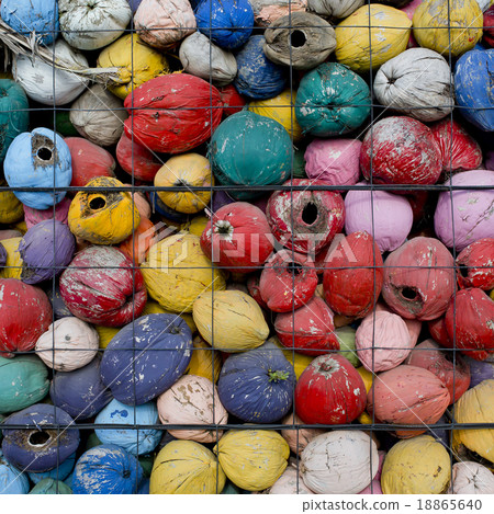 colorful waste of coconut husks in grate  18865640