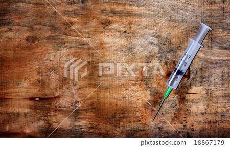 syringe on table 18867179