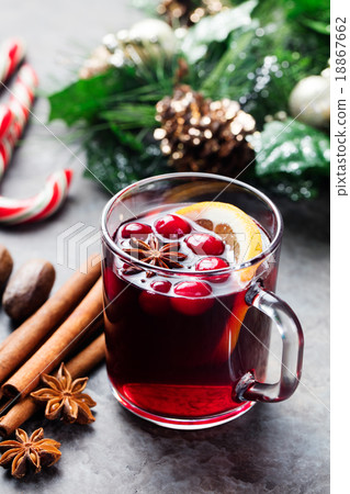 Mulled red wine with spices, cranberries slices  18867662