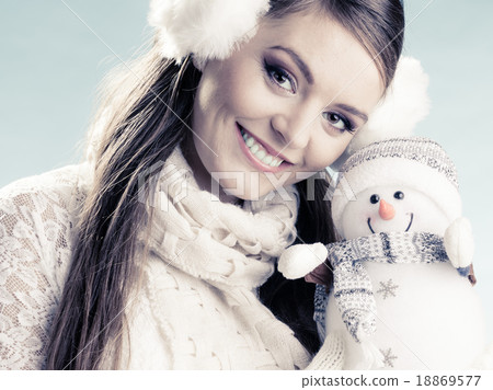 Smiling cute woman with little snowman. Winter. Smiling cute woman with little snowman. Winter. 18869577