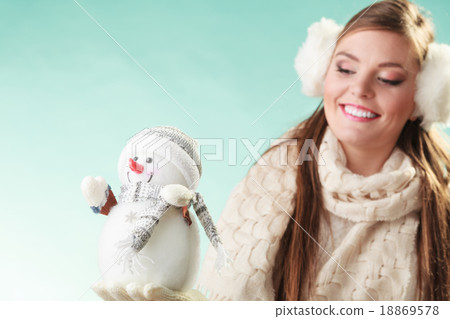Smiling cute woman with little snowman. Winter. 18869578
