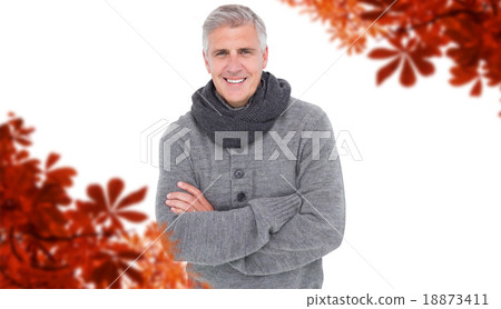 Composite image of casual man in warm clothing 18873411