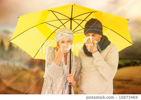 Composite image of couple sneezing in tissue while standing unde Composite image of couple sneezing in tissue while standing unde 18873469