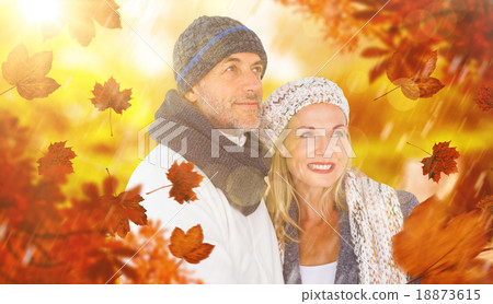 Composite image of cheerful couple in warm clothing Composite image of cheerful couple in warm clothing 18873615
