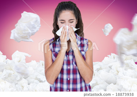 Composite image of beautiful woman sneezing in a tissue Composite image of beautiful woman sneezing in a tissue 18873938