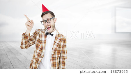 Composite image of geeky hipster in party hat pointing Composite image of geeky hipster in party hat pointing 18873955