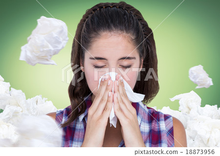 Composite image of close-up of sick woman sneezing in a tissue Composite image of close-up of sick woman sneezing in a tissue 18873956