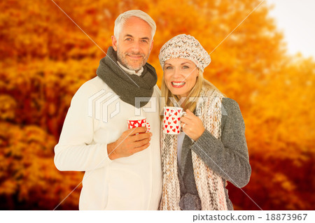 Composite image of portrait of happy couple drinking hot coffee 18873967