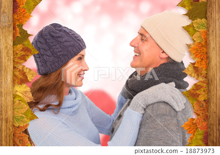 Composite image of happy couple in warm clothing Composite image of happy couple in warm clothing 18873973
