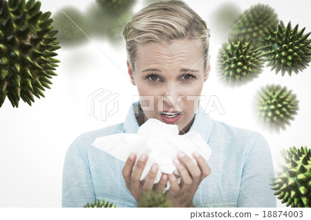 Composite image of blonde sick woman holding lots of tissues Composite image of blonde sick woman holding lots of tissues 18874003