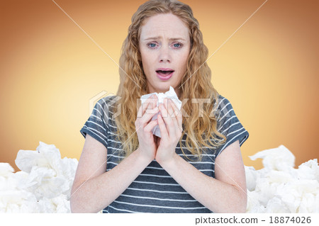 Composite image of sick woman sneezing in a tissue Composite image of sick woman sneezing in a tissue 18874026