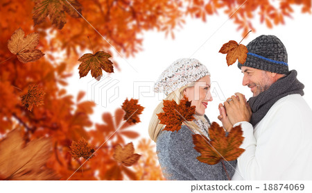 Composite image of cute smiling couple holding hands 18874069