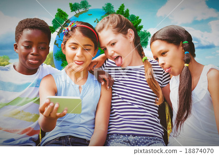 Composite image of happy children taking selfie at park 18874070