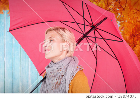 Composite image of happy woman keeping dry Composite image of happy woman keeping dry 18874073