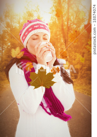 Composite image of attractive brunette holding coffee cup Composite image of attractive brunette holding coffee cup 18874074