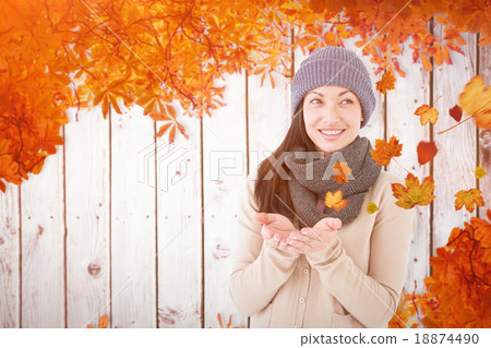 Composite image of smiling brunette presenting her hands Composite image of smiling brunette presenting her hands 18874490