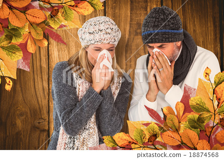 Composite image of couple sneezing in tissue 18874568