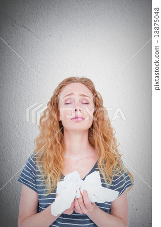 Composite image of sick blonde woman holding paper tissue Composite image of sick blonde woman holding paper tissue 18875048