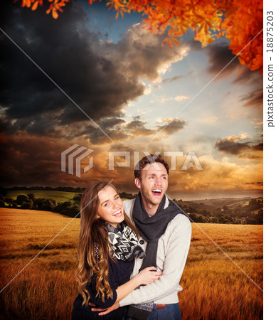 Composite image of happy young couple embracing Composite image of happy young couple embracing 18875203