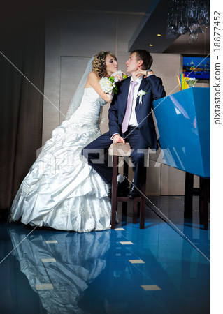 Beautiful young bride and groom next to bar Beautiful young bride and groom next to bar 18877452