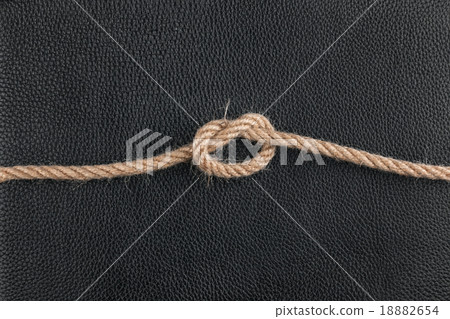knot of the rope lies on the natural leather knot of the rope lies on the natural leather 18882654
