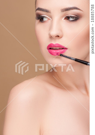 Cheerful model is receiving treatment at beauty 18885788