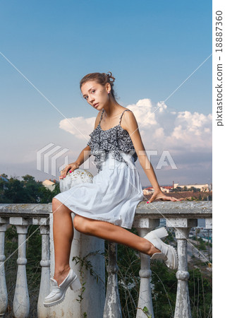Beautiful girl in bodysuit posing with classical Beautiful girl in bodysuit posing with classical 18887360
