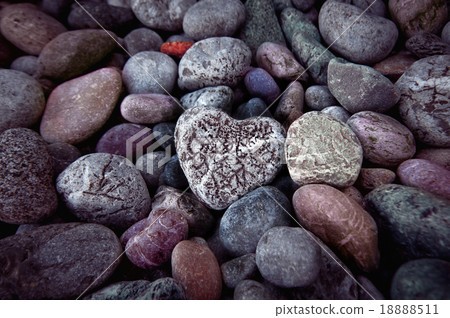 Single heart on black pebble stones, still life. Single heart on black pebble stones, still life. 18888511
