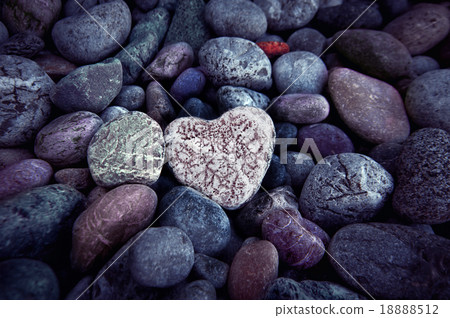 Single  heart on black pebble stones, still life. 18888512