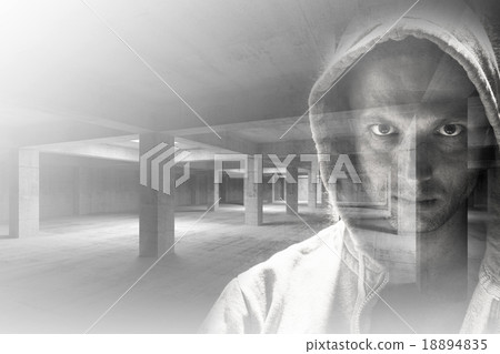 Man in hood combined with industrial interior 18894835