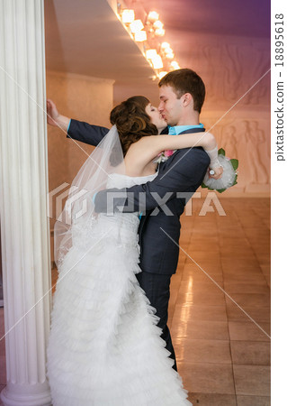 groom and the bride with a wedding bouquet  18895618
