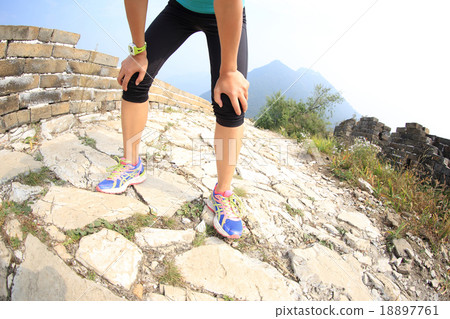 tired woman runner take a rest on stone trail tired woman runner take a rest on stone trail 18897761