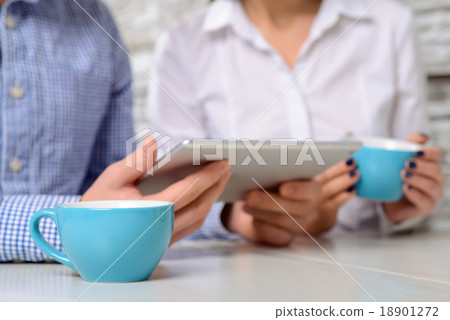 Happy friends sitting in the cafe Happy friends sitting in the cafe 18901272